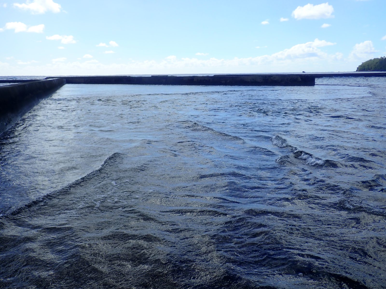 Harbor tide-gauge placement plan: Team chose the far side of Mangaia harbor for the tide gauge, planning to attach it to rock in a shallow-bank hole and measure it directly with GPS.