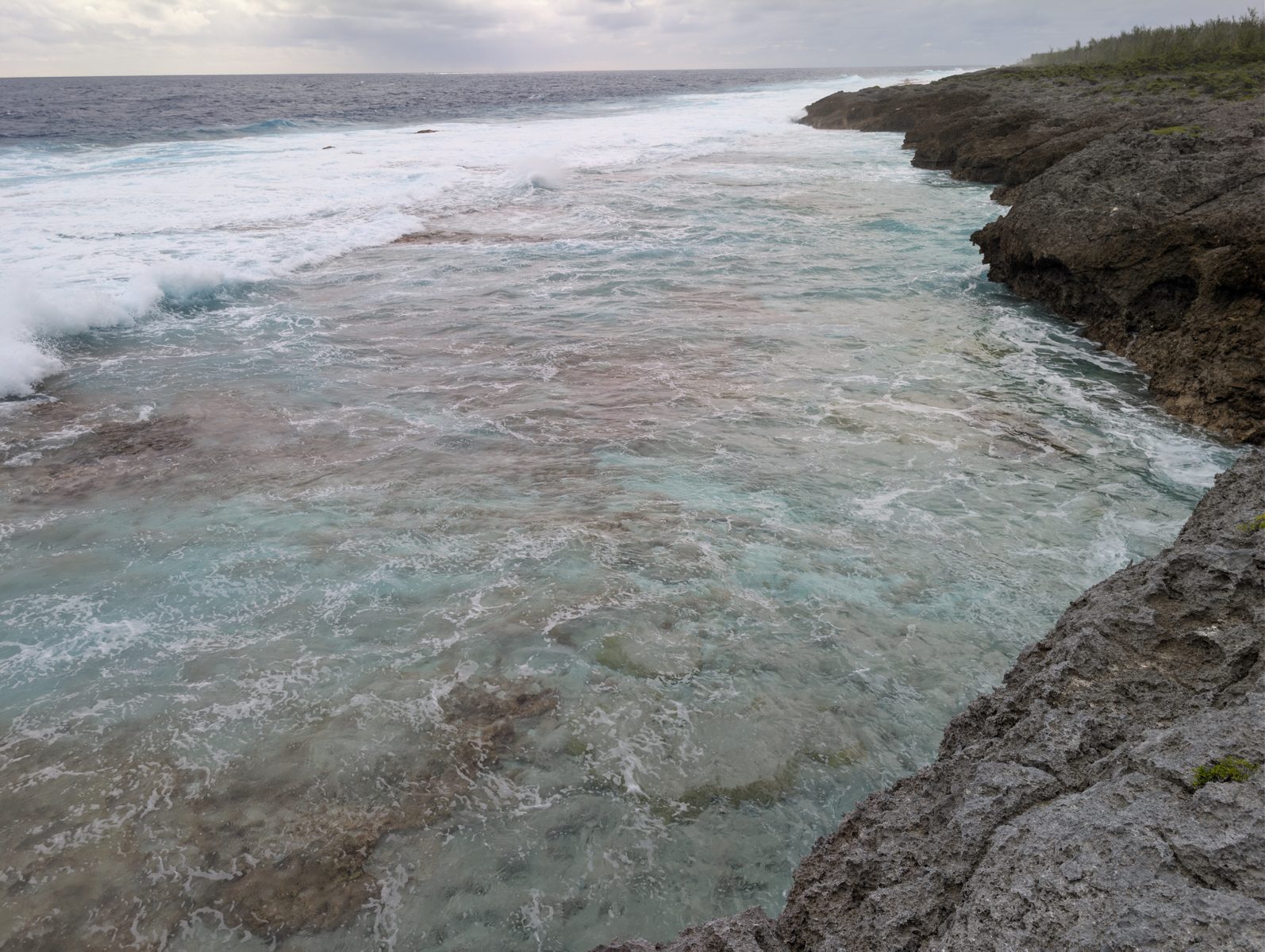 HS124 wind setup microatolls: Wind and waves pushed water across microatoll-like colored rims on the reef flat.