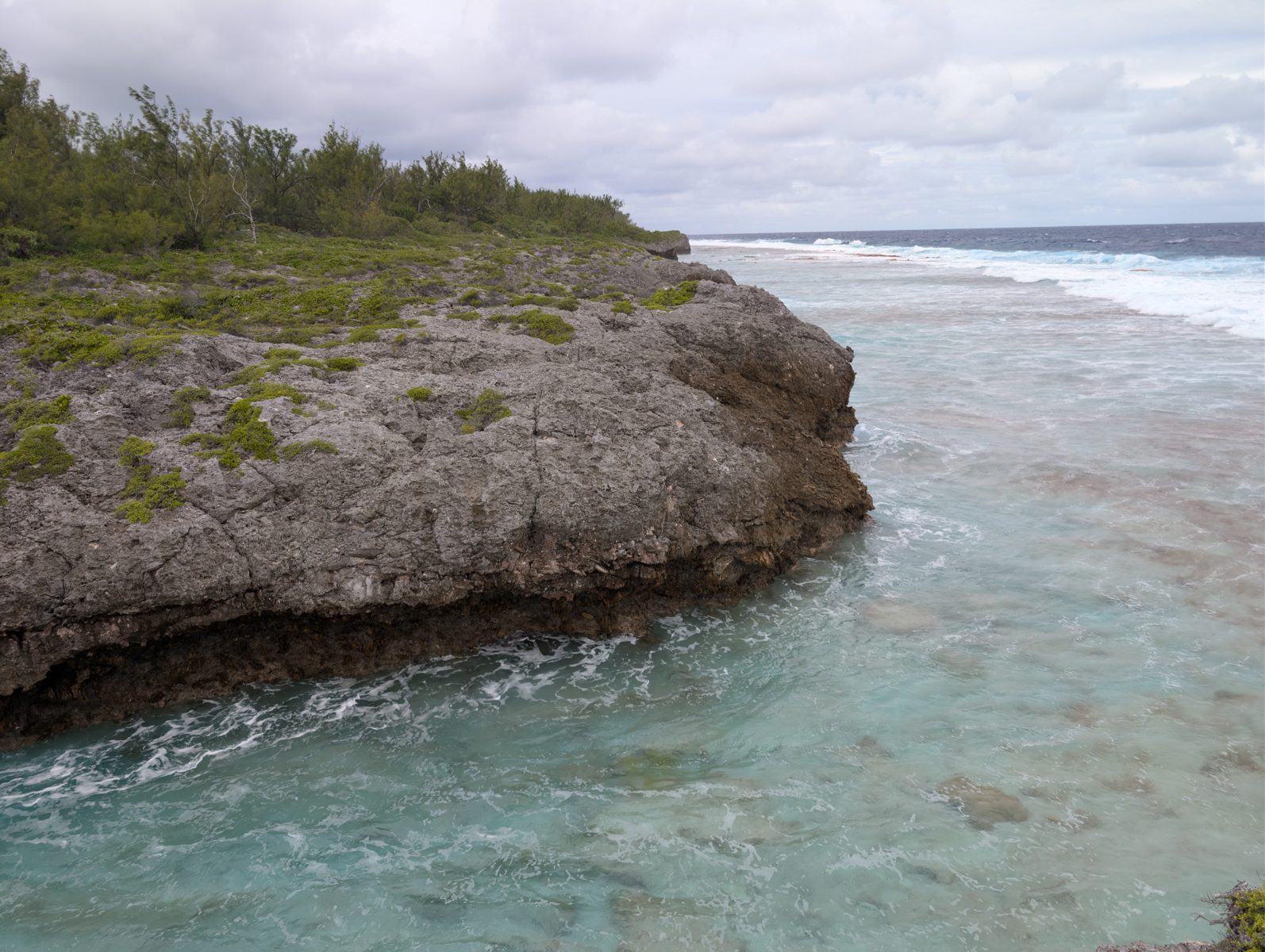 HS124 wind setup microatolls: Wind and waves pushed water across microatoll-like colored rims on the reef flat.